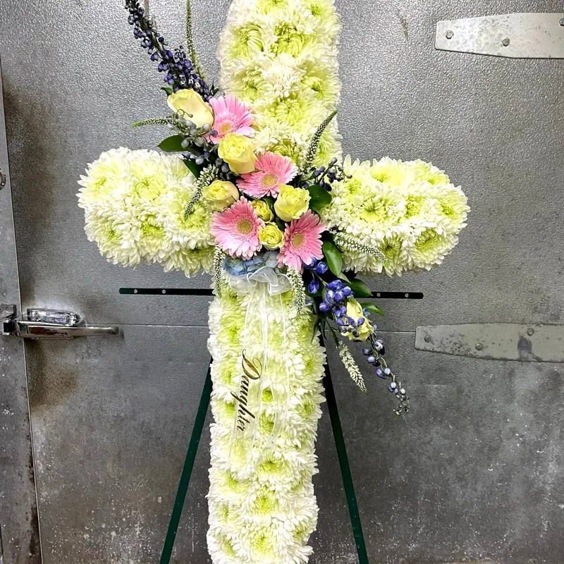 White flower cross memorial arrangement